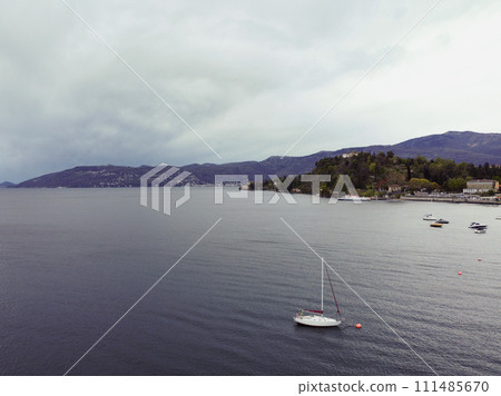 Aerial view of yacht sailing near beautiful Islands. Beautiful clouds mountains 111485670