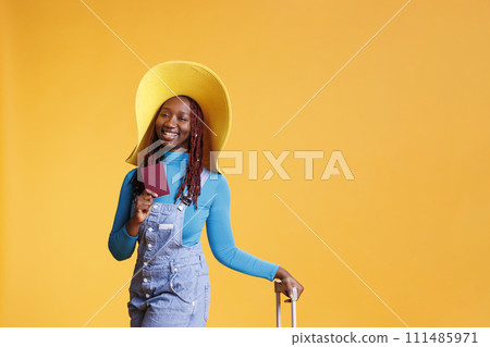 Woman travelling with id documentation on international airplane flight for vacation abroad, weekend activity. Joyful girl with passport leaving on holiday trip, leisure destination. 111485971