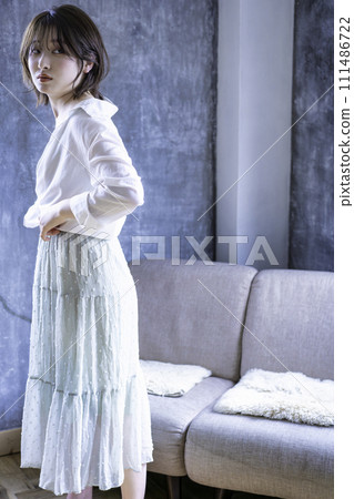 Young woman coordinating clothes Young woman coordinating clothes 111486722