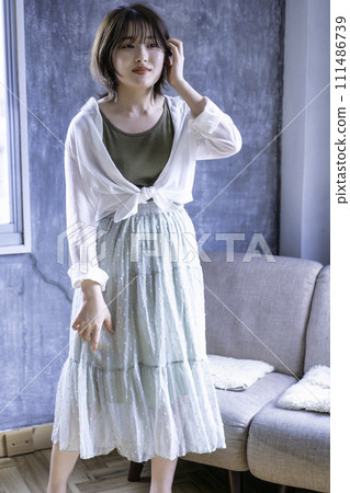 Young woman coordinating clothes Young woman coordinating clothes 111486739