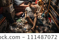 Asian man in a garbage house 111487072