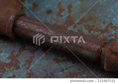 Rusty plumb tube on rusty metal wall Rusty plumb tube on rusty metal wall 111487532