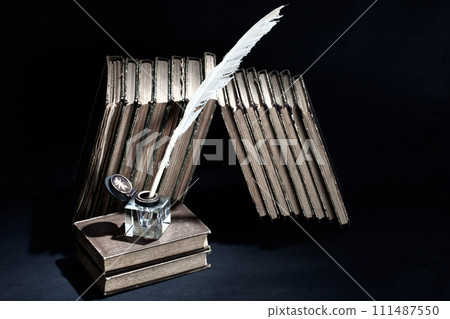 antique books with ink pen and inkpot antique books with ink pen and inkpot 111487550