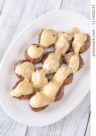 Swedish meatballs with cream sauce 111488131