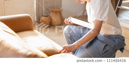 A man assessing unnecessary items A man assessing unnecessary items 111488416