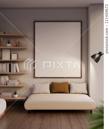 A modern, cozy Scandinavian living room features a beige couch and a blank frame mockup on the wall. A modern, cozy Scandinavian living room features a beige couch and a blank frame mockup on the wall. 111489673