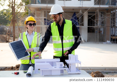 Team young engineer or architect meeting and planning installation solar panel. Team young engineer or architect meeting and planning installation solar panel. 111490650