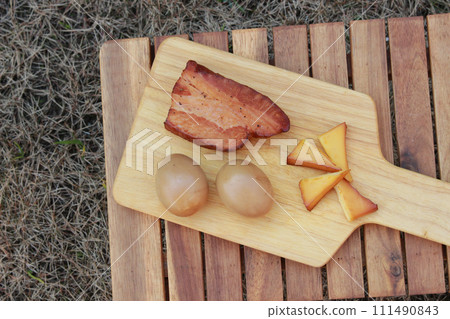 smoked food on cutting board 111490843