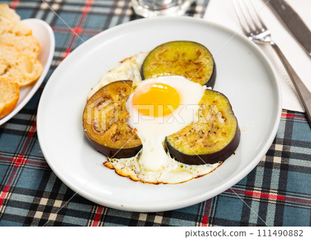 Appetizing fried eggs made with eggplants 111490882