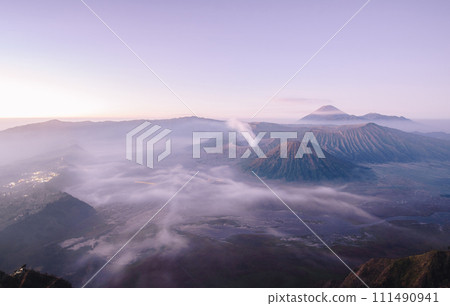 Wide angle view of Mount Bromo in the early morning. This is an active volcano part of the Tengger massif, in East Java, Indonesia. 111490941