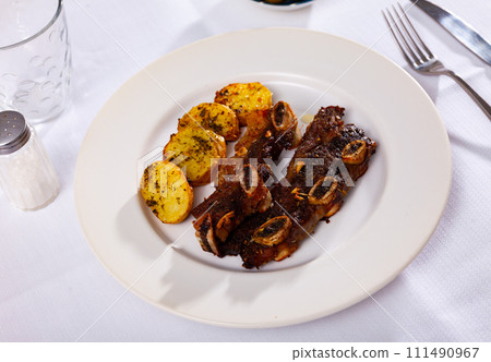 Beef rib steak, churrasco, with fried potatoes 111490967
