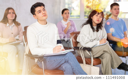 Young student attending training session in lecture class 111491008