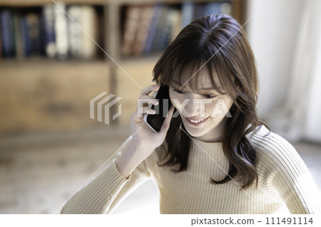 Women calling on a smartphone 111491114