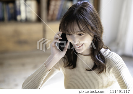 Women calling on a smartphone 111491117