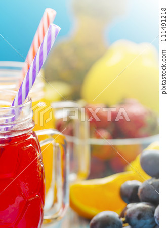 Fresh pineapple and strawberry smoothie in glasses with fruits Fresh pineapple and strawberry smoothie in glasses with fruits 111491218