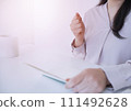 Image of a woman happy to see her bankbook 111492628