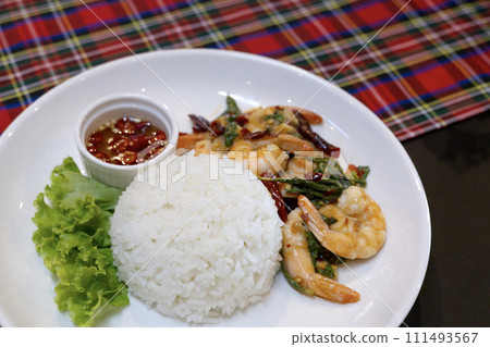 rice and stir-fried shrimps with Thai basil. Asian food style. rice and stir-fried shrimps with Thai basil. Asian food style. 111493567