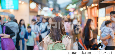 woman traveler visiting in Taiwan, Tourist with bag sightseeing and Shopping in Shilin Night Market, landmark and popular attractions in Taipei city. Asia Travel and Vacation concept 111495241