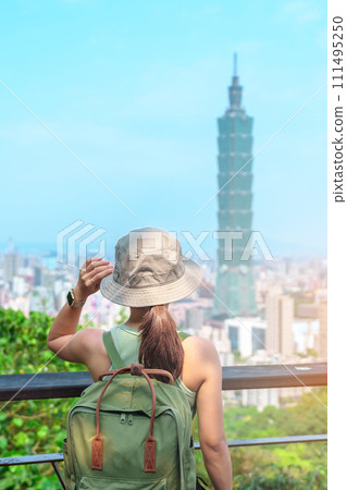 woman traveler visiting in Taiwan, Tourist looking Taipei City during sightseeing and hiking at Elephant Mountain or Xiangshan, landmark and popular attractions. Asia Travel, vacation and Trip concept woman traveler visiting in Taiwan, Tourist looking Taipei City during sightseeing and hiking at Elephant Mountain or Xiangshan, landmark and popular attractions. Asia Travel, vacation and Trip concept 111495250