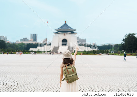 woman traveler visiting in Taiwan, Tourist with backpack sightseeing in National Chiang Kai shek Memorial or Hall Freedom Square, Taipei City. landmark and popular attractions. Asia Travel concept woman traveler visiting in Taiwan, Tourist with backpack sightseeing in National Chiang Kai shek Memorial or Hall Freedom Square, Taipei City. landmark and popular attractions. Asia Travel concept 111495636