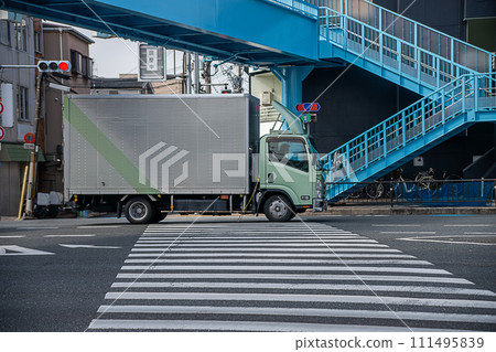 Panel truck passing through an intersection Panel truck passing through an intersection 111495839