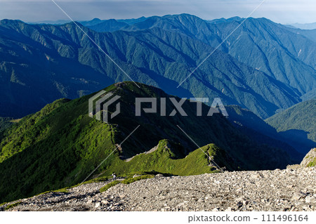 The mountain range towards Mt. Hikaru seen from the summit of Mt. Hijiri in the Southern Alps 111496164