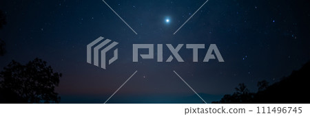 travel and people activity concept with star in the night with tree on mountain and lighting of city background 111496745