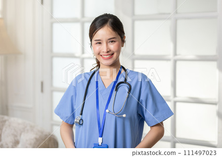 Asian female doctor with a stethoscope smile looking at camera.Nurses wear scrub smile with heartwarming comfortable.Positive emotional and good moment.Health Care Concept 111497023