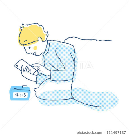 A man looking at his smartphone before going to bed 111497187