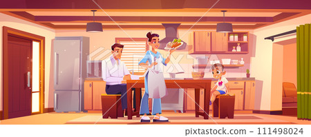 Happy family eating breakfast together at home 111498024