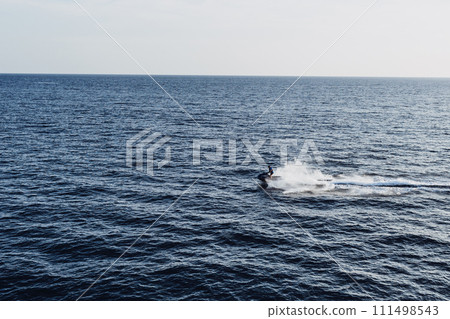 jet skiing. Mediterranean Sea. coastline and rescue boat 111498543