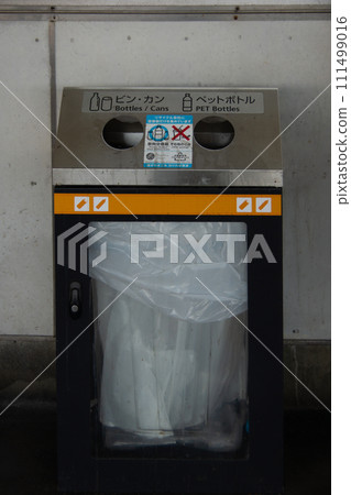Trash bins for bottles, cans, and plastic bottles at stations 111499016