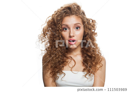 Surprise woman looking up with opened mouth. Healthy excited female model with natural make-up 111503989