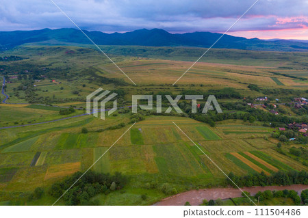 Aerial view of a storm and clouds above a village Aerial view of a storm and clouds above a village 111504486