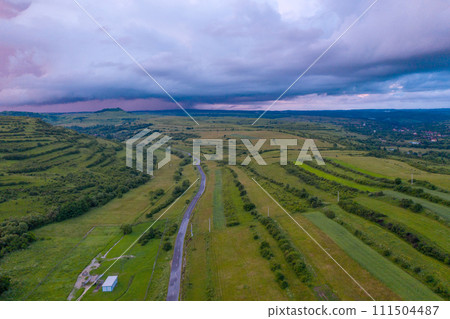 Aerial view of a storm and clouds above a village Aerial view of a storm and clouds above a village 111504487