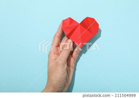Heart on a blue background, the concept of treating cardiovascular diseases. Heart on a blue background, the concept of treating cardiovascular diseases. 111504999