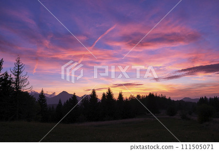 A beautiful colorful sunset, clouds changing colors from yellow to red, pastel colours of the sky A beautiful colorful sunset, clouds changing colors from yellow to red, pastel colours of the sky 111505071