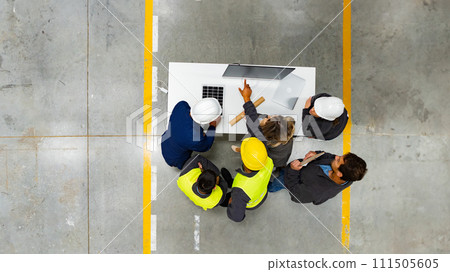 Top view of full team of warehouse employees in warehouse. Team of workers, managers, female director in modern factory, heavy industry, manufactrury. Top view of full team of warehouse employees in warehouse. Team of workers, managers, female director in modern factory, heavy industry, manufactrury. 111505605