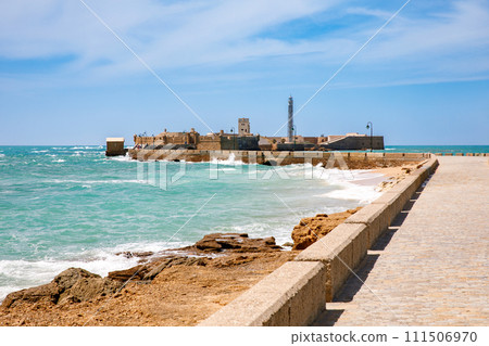 La Caleta Beach, Balneario de la Palma Building and Castle of San Sebastian at sunset - Cadiz, Andalusia, Spain 111506970