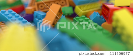 Colored toy bricks background. Rainbow colors. Random coloured plastic construction blocks. 3d illustration 111506977