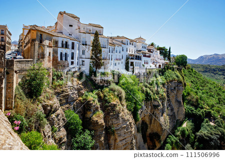 Ronda, Spain. Aerial evening view of New Bridge over Guadalevin River in Ronda, Andalusia, Spain. View of the touristic city. Ronda, Spain. Aerial evening view of New Bridge over Guadalevin River in Ronda, Andalusia, Spain. View of the touristic city. 111506996