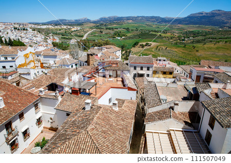 Ronda ind Andalusia, Spain. View from above on the touristic city, houses and roofs. Ronda ind Andalusia, Spain. View from above on the touristic city, houses and roofs. 111507049