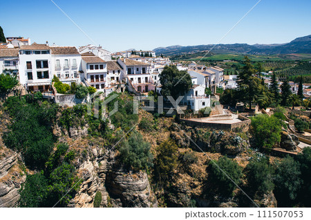 Ronda, Spain. Aerial evening view of New Bridge over Guadalevin River in Ronda, Andalusia, Spain. View of the touristic city. 111507053