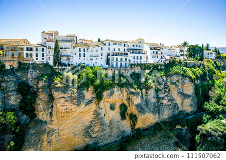 Ronda, Spain. Aerial evening view of New Bridge over Guadalevin River in Ronda, Andalusia, Spain. View of the touristic city. 111507062