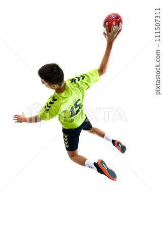 Top view image of young guy, handball player in motion during game playing, training against white studio background Top view image of young guy, handball player in motion during game playing, training against white studio background 111507311