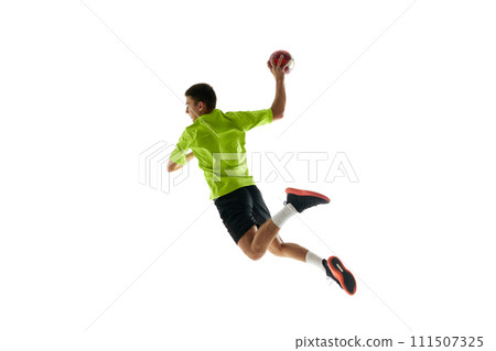 Competitive and concentrated young guy, handball player in motion during game, training against white studio background 111507325