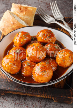 Chipotle Honey Meatballs are the perfect sweet and spicy Mexican appetizer closeup on the bowl. Vertical Chipotle Honey Meatballs are the perfect sweet and spicy Mexican appetizer closeup on the bowl. Vertical 111508086