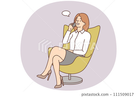 Smiling businesswoman in chair talking on cell Smiling businesswoman in chair talking on cell 111509017