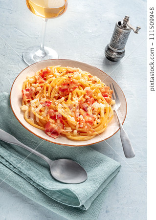 Carbonara pasta dish, traditional spaghetti with pancetta and cheese Carbonara pasta dish, traditional spaghetti with pancetta and cheese 111509948