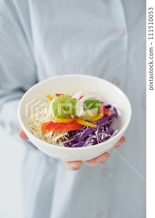 The young woman is holding Salad The young woman is holding Salad 111510053